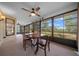 Sunroom with large windows and views of the outdoors at 21425 Sw Plantation St, Dunnellon, FL 34431