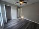 This bedroom features a closet with white doors and access to the bathroom at 235 Locust Pass Ln, Ocala, FL 34472