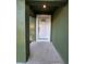 Inviting entryway featuring a white front door and neutral-colored walls at 235 Locust Pass Ln, Ocala, FL 34472