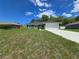 Welcoming home with an attached two-car garage and meticulously kept front yard at 235 Locust Pass Ln, Ocala, FL 34472