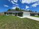 Lovely single-Gathering home boasts a two-car garage and beautiful landscaping at 235 Locust Pass Ln, Ocala, FL 34472