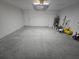 Oversized garage with a clean epoxy floor and plenty of room for two cars and storage at 235 Locust Pass Ln, Ocala, FL 34472