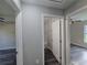 This hallway features a view of the bathroom and bedrooms at 235 Locust Pass Ln, Ocala, FL 34472
