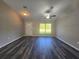 Bright living room features a large window, new wood floors, and ample space at 235 Locust Pass Ln, Ocala, FL 34472