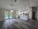 Open concept living space featuring an island kitchen and lots of light at 235 Locust Pass Ln, Ocala, FL 34472