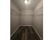 Walk-in closet featuring wire shelving and modern flooring at 235 Locust Pass Ln, Ocala, FL 34472