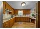 Efficient kitchen featuring wood cabinetry, ample counter space, and great natural light at 23737 Nw Mallard Ave, Dunnellon, FL 34431