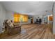 The expansive living room is adorned with wood laminate flooring and has an open bright concept at 23737 Nw Mallard Ave, Dunnellon, FL 34431