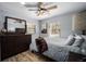 Charming bedroom with a ceiling fan, wood floors, and plenty of natural light at 3250 Sw 46Th Ave, Ocala, FL 34474