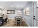 Cozy dining room featuring natural light, wood floors, and stylish decor, open to the kitchen at 3250 Sw 46Th Ave, Ocala, FL 34474