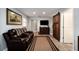 Comfortable living room with ample seating, a mounted TV, and easy access to other areas at 3250 Sw 46Th Ave, Ocala, FL 34474