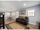 Cozy living room features a leather couch, area rug, and lots of natural light at 3250 Sw 46Th Ave, Ocala, FL 34474