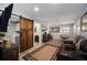Inviting living space with a sliding barn door feature, connecting seamlessly to other rooms at 3250 Sw 46Th Ave, Ocala, FL 34474