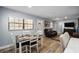 Comfortable dining area open to a cozy living room with natural light and modern decor at 3250 Sw 46Th Ave, Ocala, FL 34474