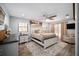 Spacious main bedroom with a decorative rug, ceiling fan and sliding glass doors at 3250 Sw 46Th Ave, Ocala, FL 34474