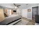 Comfortable main bedroom with a ceiling fan, and access to an ensuite bathroom at 3250 Sw 46Th Ave, Ocala, FL 34474