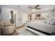 Bright main bedroom featuring a ceiling fan, closet, and ensuite bathroom at 3250 Sw 46Th Ave, Ocala, FL 34474