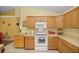 Kitchen features white appliances, light-colored cabinets, and a microwave at 3792 Sw 152Nd Ct, Ocala, FL 34481