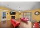 Bright living room featuring comfortable seating, a cozy fireplace, and a large sliding glass door at 3792 Sw 152Nd Ct, Ocala, FL 34481