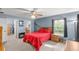Comfortable main bedroom featuring a ceiling fan, ensuite bathroom, and a walk-in closet at 3792 Sw 152Nd Ct, Ocala, FL 34481