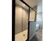 Modern bathroom featuring a tiled shower with glass door and a built-in tub at 4374 Sw Viola Ct, Dunnellon, FL 34431