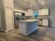 The kitchen has stainless steel appliances, granite countertops, and recessed lighting at 4374 Sw Viola Ct, Dunnellon, FL 34431