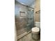 Sleek bathroom featuring a glass-enclosed shower with stylish tile work and modern fixtures at 4513 Nw 30Th Pl, Ocala, FL 34482