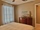 Bedroom with wood laminate flooring and decorative headboard at 4513 Nw 30Th Pl, Ocala, FL 34482