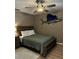 Cozy bedroom with a ceiling fan and marine decor, providing a comfortable and personalized living space at 4513 Nw 30Th Pl, Ocala, FL 34482