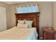 Bedroom with wood laminate flooring and decorative headboard at 4513 Nw 30Th Pl, Ocala, FL 34482