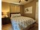 Comfortable bedroom with a stylish bed, soft lighting, and a modern ceiling fan at 4513 Nw 30Th Pl, Ocala, FL 34482