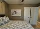 Bedroom with a bed and framed painting on the wall at 4513 Nw 30Th Pl, Ocala, FL 34482