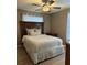 Bedroom with wood laminate flooring and decorative headboard at 4513 Nw 30Th Pl, Ocala, FL 34482