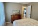 Bedroom with wood laminate flooring and decorative headboard at 4513 Nw 30Th Pl, Ocala, FL 34482