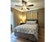 Inviting bedroom with ceiling fan, complemented by soft natural light and cozy décor at 4513 Nw 30Th Pl, Ocala, FL 34482