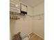 Organized walk-in closet with shelves and hanging rods, providing ample storage space at 4513 Nw 30Th Pl, Ocala, FL 34482