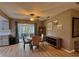 Cozy dining area with a round table, upholstered chairs, a ceiling fan, and sliding glass doors at 4513 Nw 30Th Pl, Ocala, FL 34482