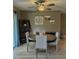 Dining area boasts a round table with upholstered chairs, modern ladder shelf, and a stylish ceiling fan at 4513 Nw 30Th Pl, Ocala, FL 34482