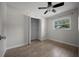 Bedroom with wood-look flooring, window, and closet at 511 Se 29Th Ter, Ocala, FL 34471