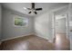 Bedroom featuring wood-look flooring, a window, and a doorway at 511 Se 29Th Ter, Ocala, FL 34471