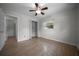 Bedroom with wood-look flooring, closet, and window at 511 Se 29Th Ter, Ocala, FL 34471