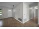Bright entryway featuring wood-look tile flooring and a white front door with sidelight at 511 Se 29Th Ter, Ocala, FL 34471