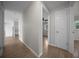 Hallway with wood-look tile flooring that connects the rooms at 511 Se 29Th Ter, Ocala, FL 34471