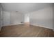 Spacious, bright living room featuring wood-look tile flooring and neutral wall color at 511 Se 29Th Ter, Ocala, FL 34471