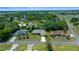 An aerial view of a residential neighborhood with well-maintained lawns and tree-lined streets, creating a peaceful setting at 5420 Sw 86Th Ln, Ocala, FL 34476