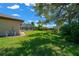 Spacious backyard showcasing the pool and screened lanai, ideal for outdoor gatherings and relaxation at 5420 Sw 86Th Ln, Ocala, FL 34476