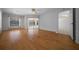 Bedroom with wood floors, sliding door to the pool, and a ceiling fan at 5420 Sw 86Th Ln, Ocala, FL 34476