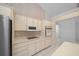Efficient kitchen with stainless steel appliances, abundant cabinet space, and convenient layout at 5420 Sw 86Th Ln, Ocala, FL 34476