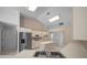 Well-lit kitchen features modern appliances, ample counter space, and tiled flooring at 5420 Sw 86Th Ln, Ocala, FL 34476