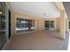 Spacious screened porch with sliding glass doors offers seamless indoor-outdoor living and views of the pool at 5420 Sw 86Th Ln, Ocala, FL 34476